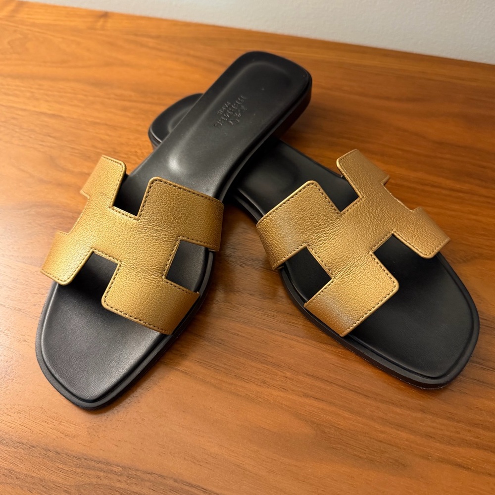 Hermes Gold and Black Oran Sandals